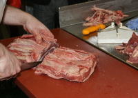 butcher cutting meat.png